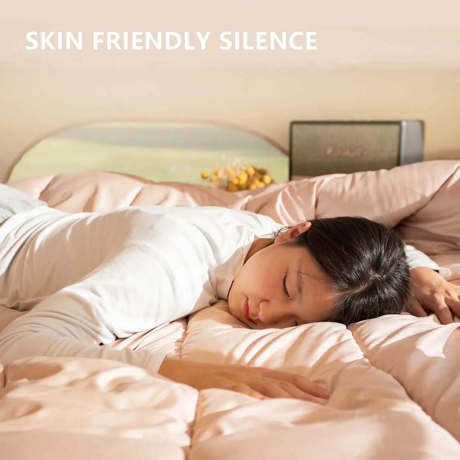Person sleeping peacefully on a BISINNA sleeping bag with soft bedding, accompanied by the text 'Skin Friendly Silence'.