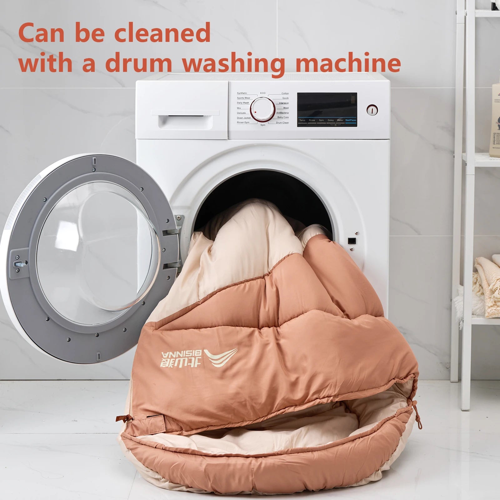 Brown BISINNA sleeping bed being placed into a washing machine with text indicating it can be cleaned with a drum washing machine.