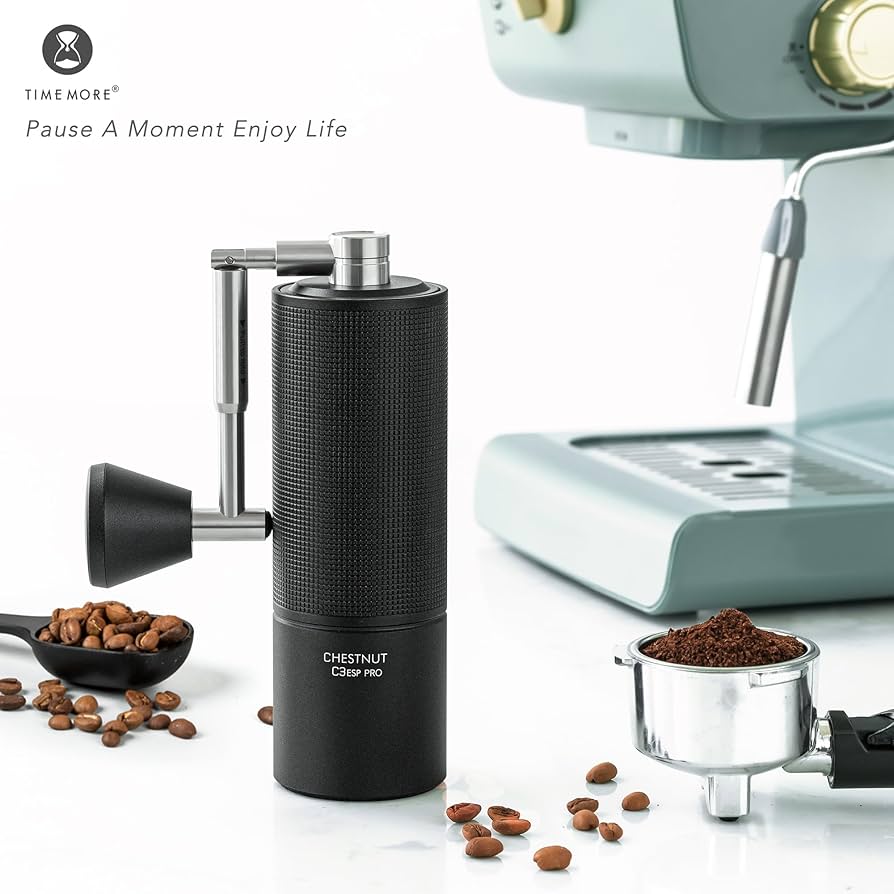 Black C3ESP Pro Coffee Grinder with coffee beans and a coffee machine on a white background