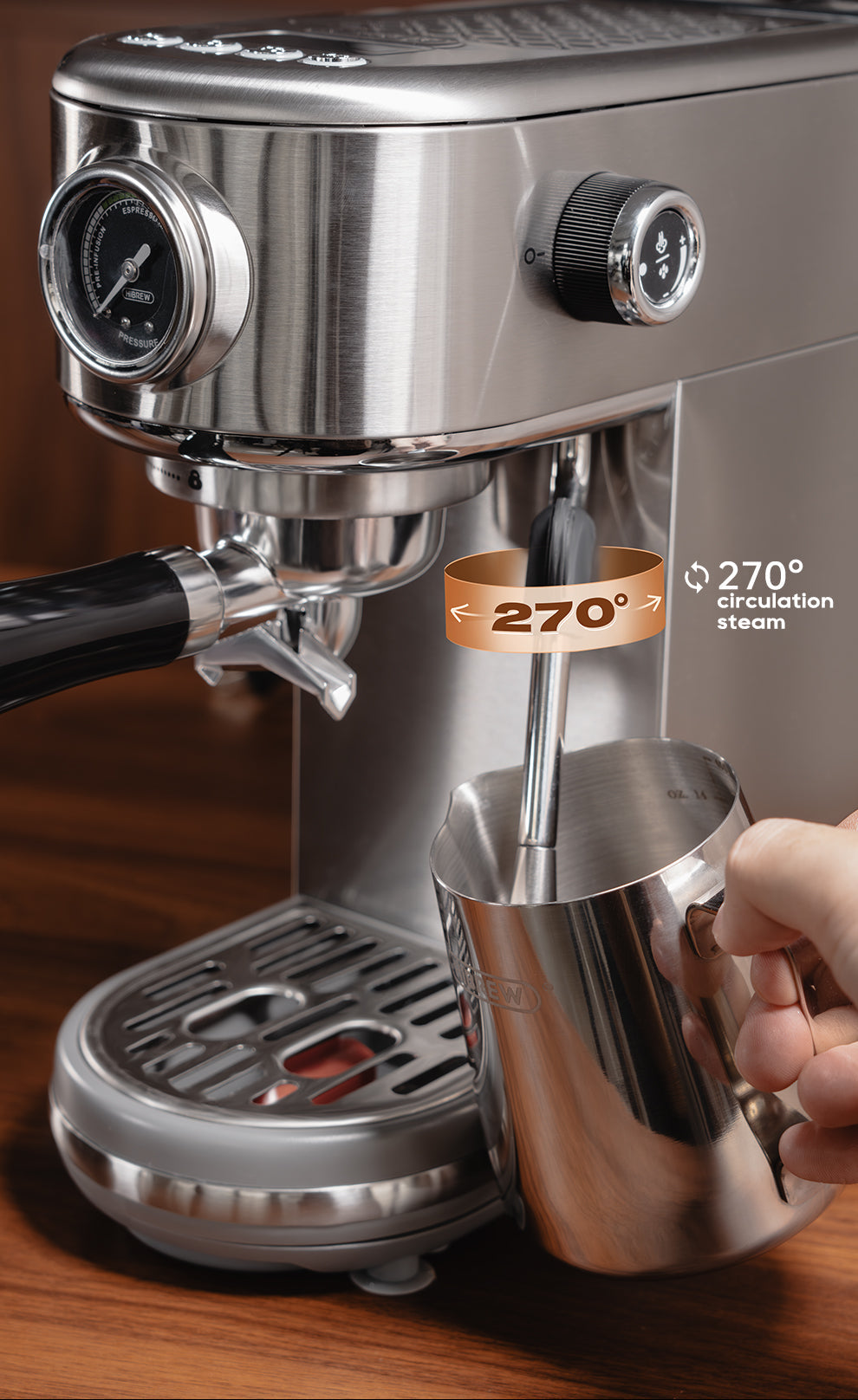 H10B Espresso machine with a milk frothing pitcher on a wooden surface