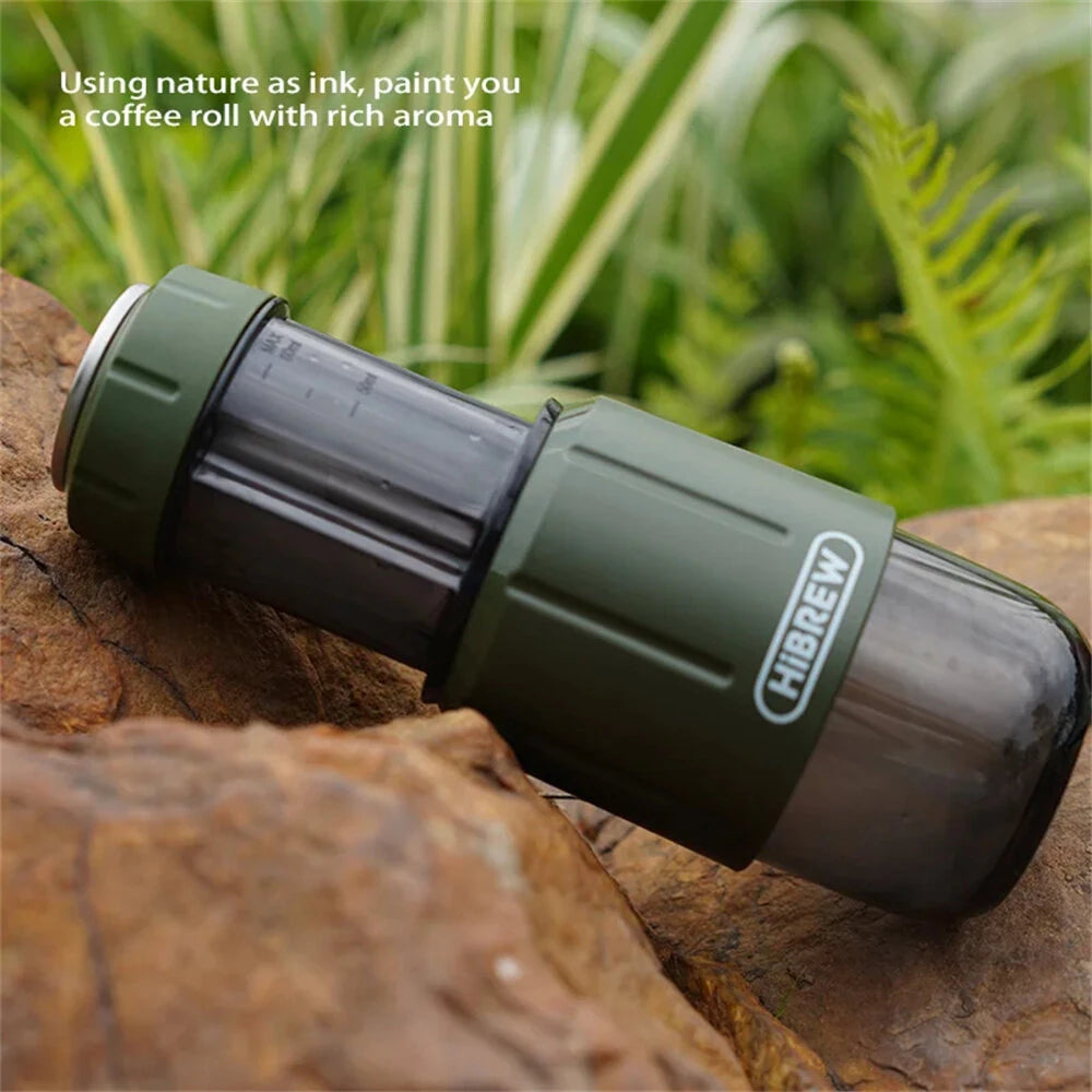 Green HIBREW H4D on a rock with greenery in the background