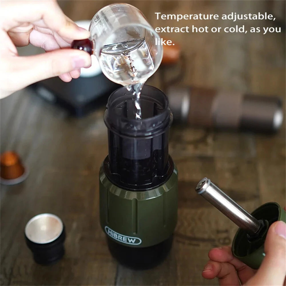 Person pouring liquid into a green H4D  portable coffee maker with text about temperature control.