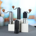 Set of four Havmore manual coffee grinders on a blurred background studio shot