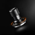 An iKAPE coffee tamper featuring a black background studio shot. 