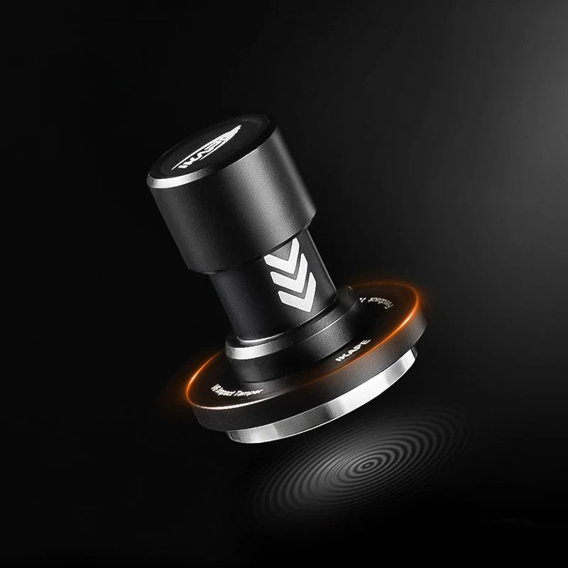 An iKAPE coffee tamper featuring a black background studio shot. 