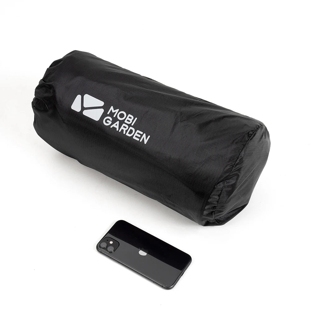 Black Mobi Garden bag with a smartphone for scale on a white background