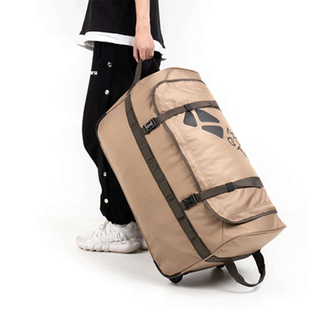 Person holding a beige Mobi Garden rolling duffel bag with a logo on a white background