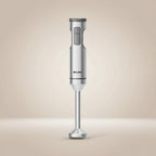 Front view of a ROUNY H1 handheld blender with a soft beige background studio shot 