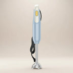Front view of a ROUNY H2 handheld blender with a soft beige background studio shot 