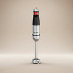 Front view of a ROUNY H4 handheld blender with a soft beige background studio shot 