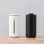 Front shot of two Timemore U French press's with a soft colour background studio shot