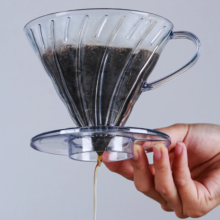 A V60 with coffee exiting the bottom 