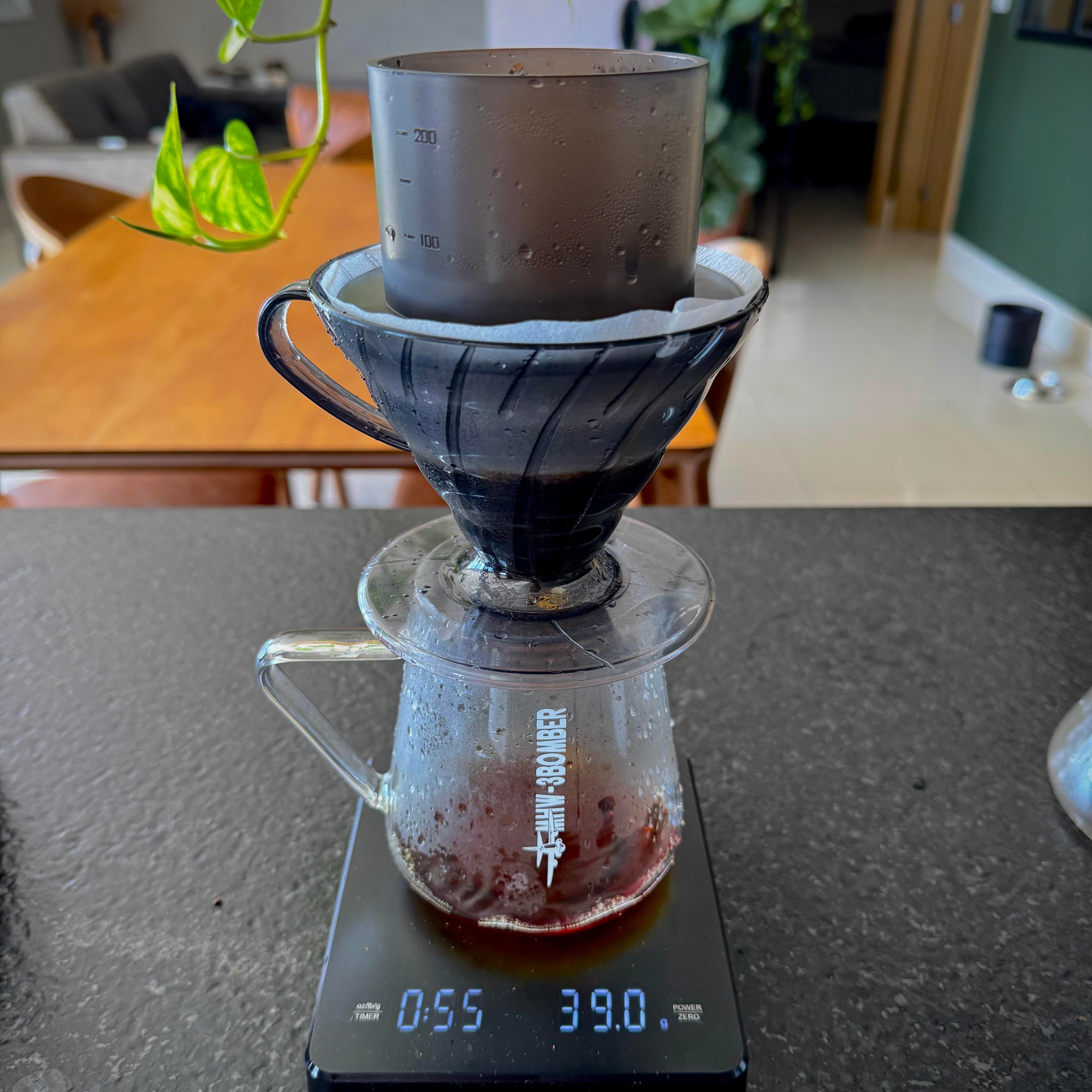 TIMEMORE Simple drip up top a Coffee brewing setup with a scale on a kitchen counter