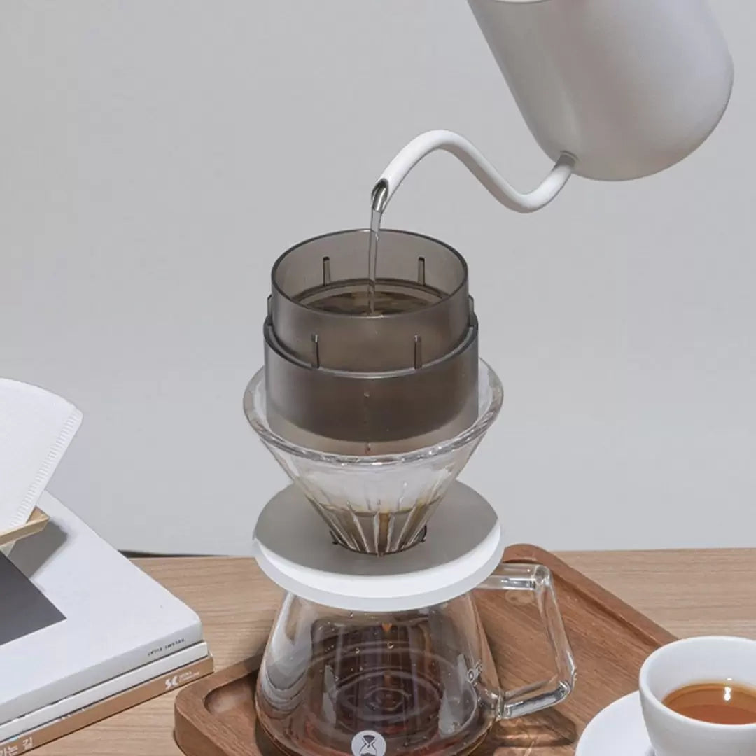 Water being poured into a TIMEMORE Simple drip over a B75 