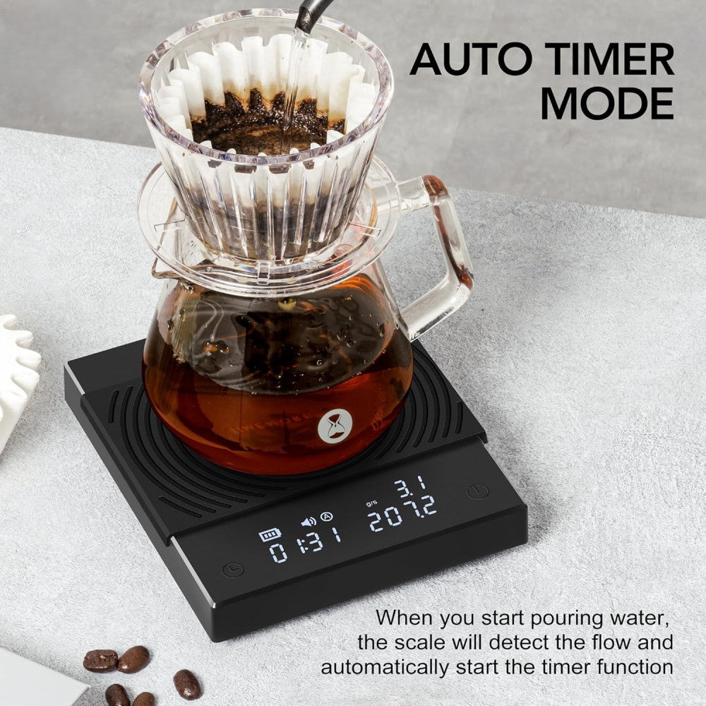 Coffee brewing setup with black mirror coffee scale displaying auto timer mode on a gray surface.